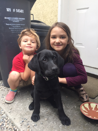 [New Lab pup Tessie with grandkids Colin and Laurel]